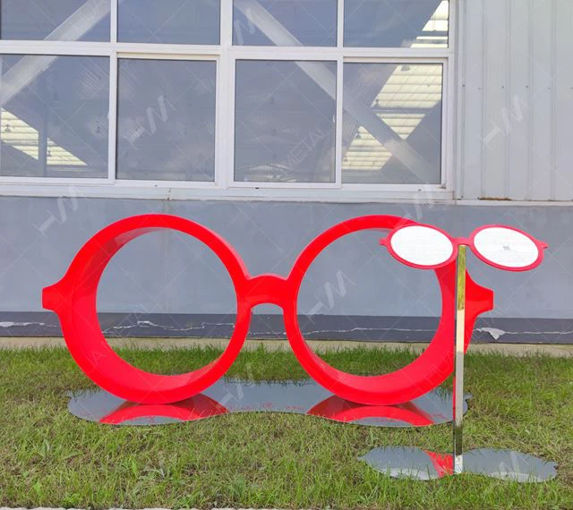 stainless steel red glasses sculpture with storyboard